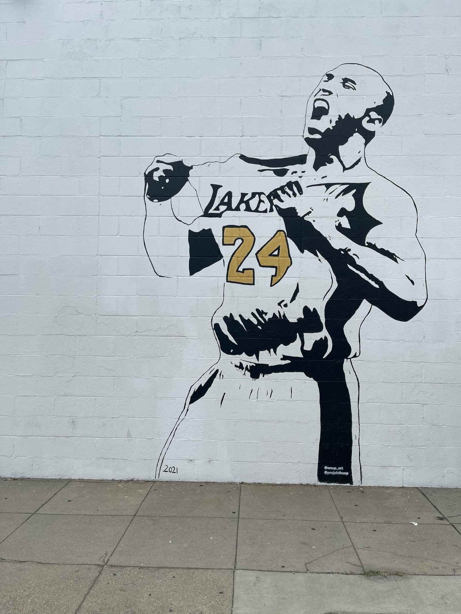 a mural of a man holding a baseball bat