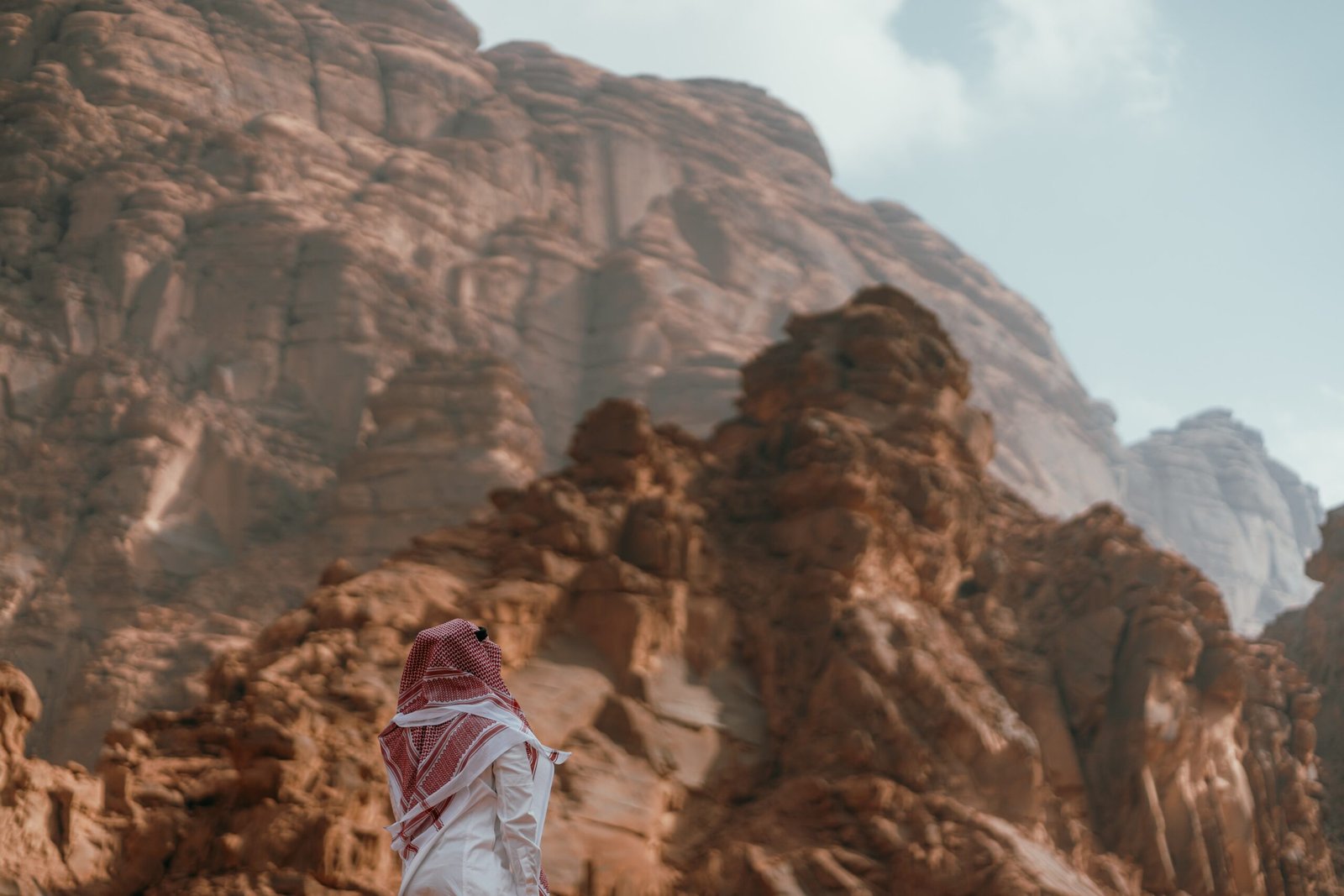 a person standing in front of a mountain