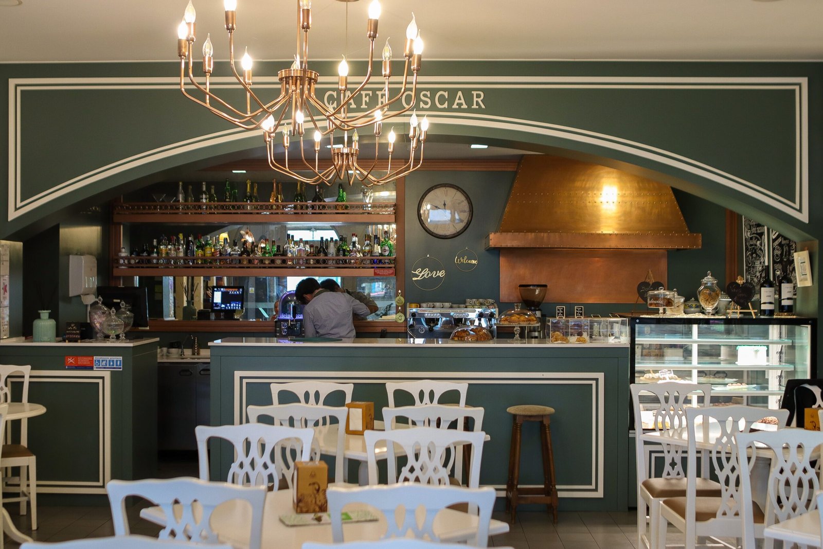 a restaurant with a chandelier hanging from the ceiling