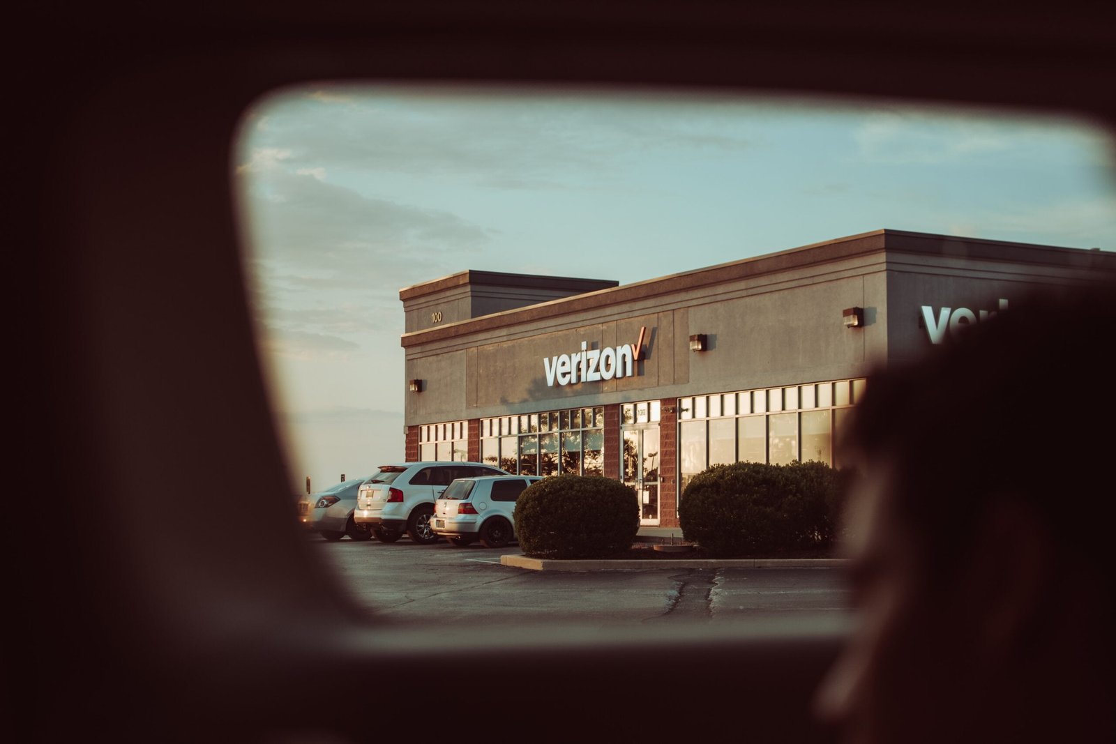 cars parked in front of store during daytime